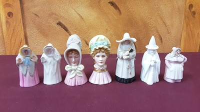 Lot 1054 - Fourteen Royal Worcester candle snuffers including Welsh lady