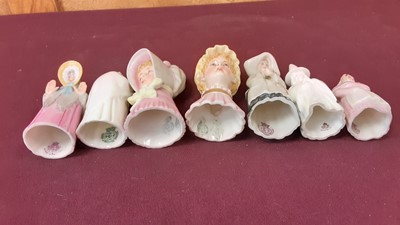 Lot 1054 - Fourteen Royal Worcester candle snuffers including Welsh lady