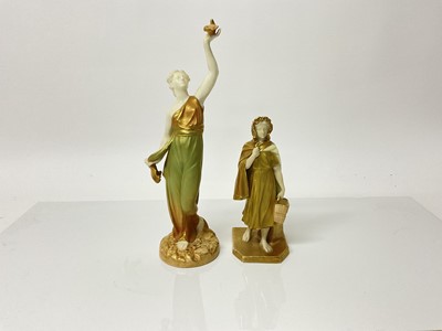 Lot 1061 - Two Royal Worcester figures - lady holding a dove and lady with bag, tallest is 26cm high, the other is 16.5cm high