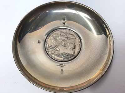 Lot 99 - Two silver pin dishes each set with a commemorative Churchill coin and Britannia coin, together with two silver ashtrays