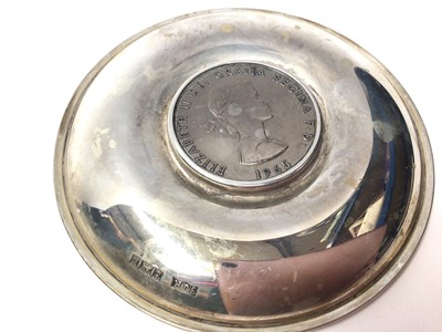 Lot 99 - Two silver pin dishes each set with a commemorative Churchill coin and Britannia coin, together with two silver ashtrays
