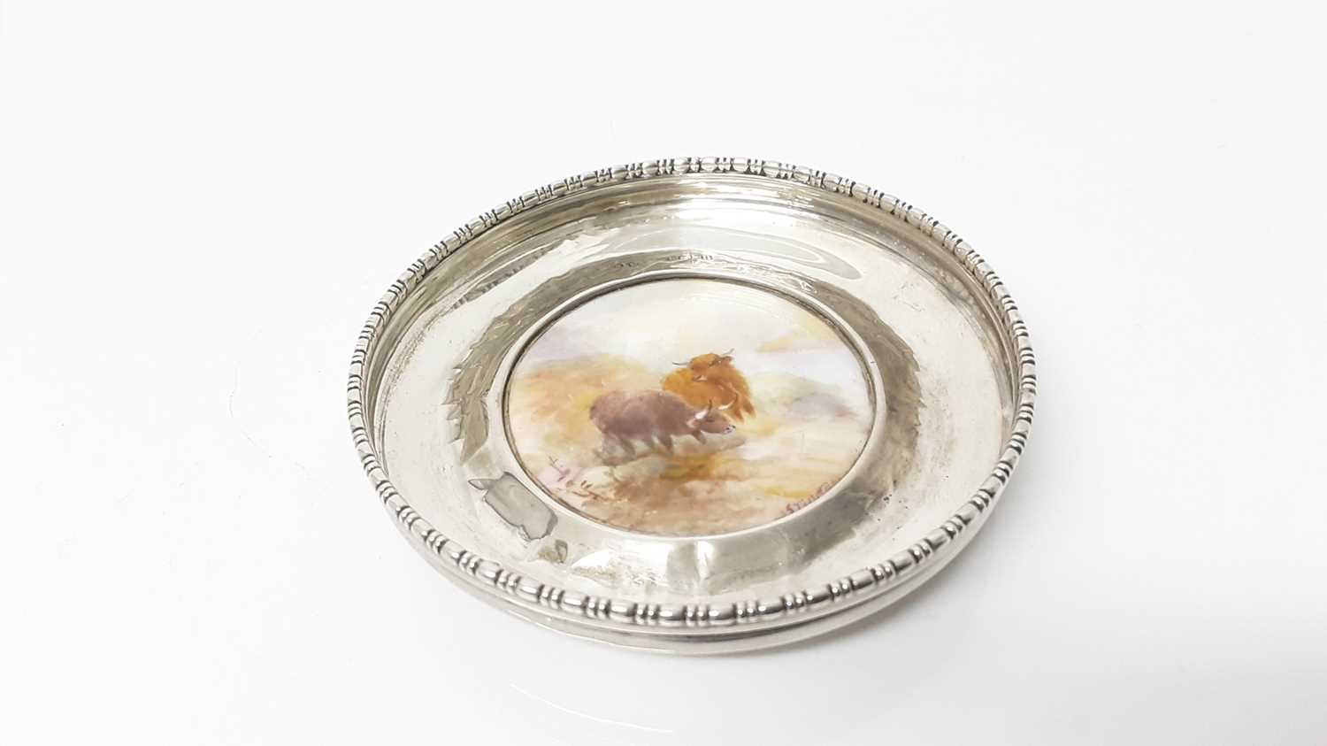 Lot 1066 - Royal Worcester silver mounted circular pin dish, with hand painted decoration depicting Highland cattle, signed J.Stinton, 8.5cm diameter