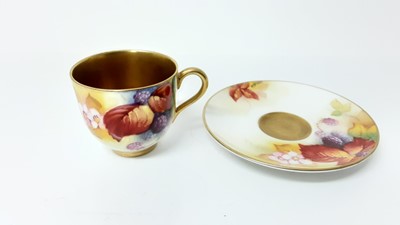 Lot 1067 - Royal Worcester cabinet cup and saucer with hand painted floral decoration, signed K.Blake