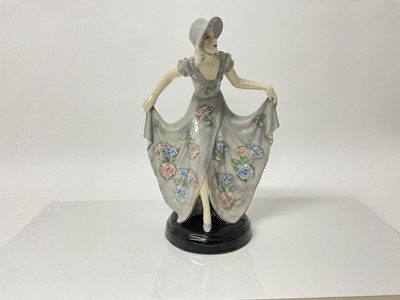 Lot 1073 - Stefan Dakon for Goldscheider a 1930's Art Deco figure of a lady in pretty dress, impressed and printed marks to base, 31.5cm high