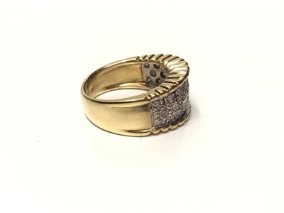 Lot 105 - 18ct gold diamond set thick band ring