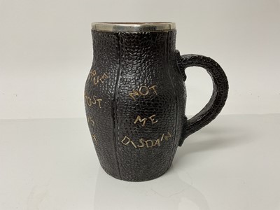 Lot 1081 - Doulton Slaters Patent stoneware jug in the form of a leather blackjack, with silver rim, impressed marks to base, 15.5cm high