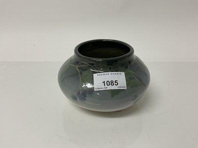 Lot 1085 - Rookwood pottery squat vase decorated with leaves and berries on grey/blue ground, impressed marks to base