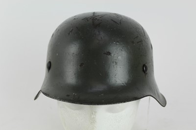 Lot 787 - Nazi M42 pattern helmet with painted finish bearing SS insignia and brown leather liner.