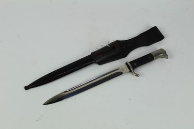 Lot 877 - Nazi Parade bayonet (long model) with black checkered platic grips, polished steel blade (retaining all original polish) by E. Pack, Solingen in scabbard with frog, dated 1941.