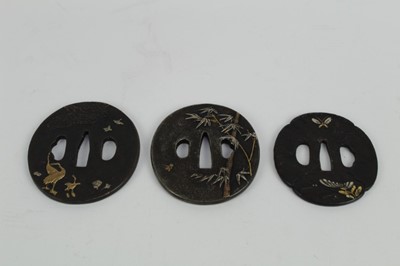 Lot 757 - Japanese bronze tsuba with decoration depicting Storks, together with two other bronze tsuba's (3)