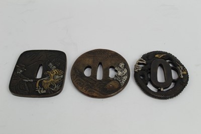 Lot 758 - Japanese bronze tsuba with decoration depicting a Dragon, together with two other bronze tsuba's (3)