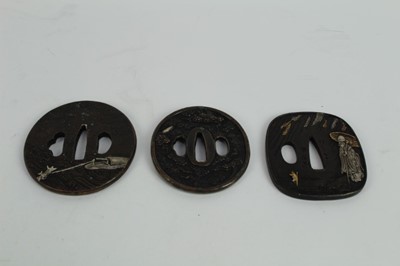 Lot 759 - Japanese bronze tsuba with decoration depicting Carp, together with two other bronze tsuba's (3)