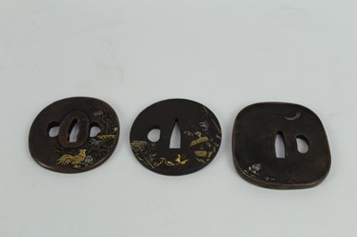 Lot 760 - Japanese bronze tsuba with figural decoration, together with two other bronze tsuba's (3)