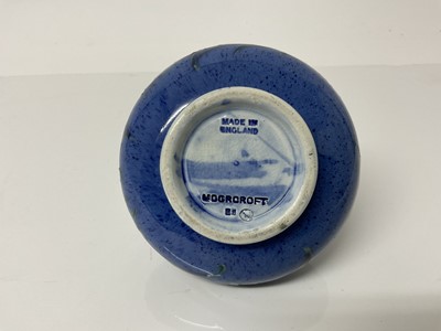 Lot 1110 - Moorcroft pottery squat vase decorated with foliage on powder blue ground, impressed marks and blue painted signature to base, 8.5cm high