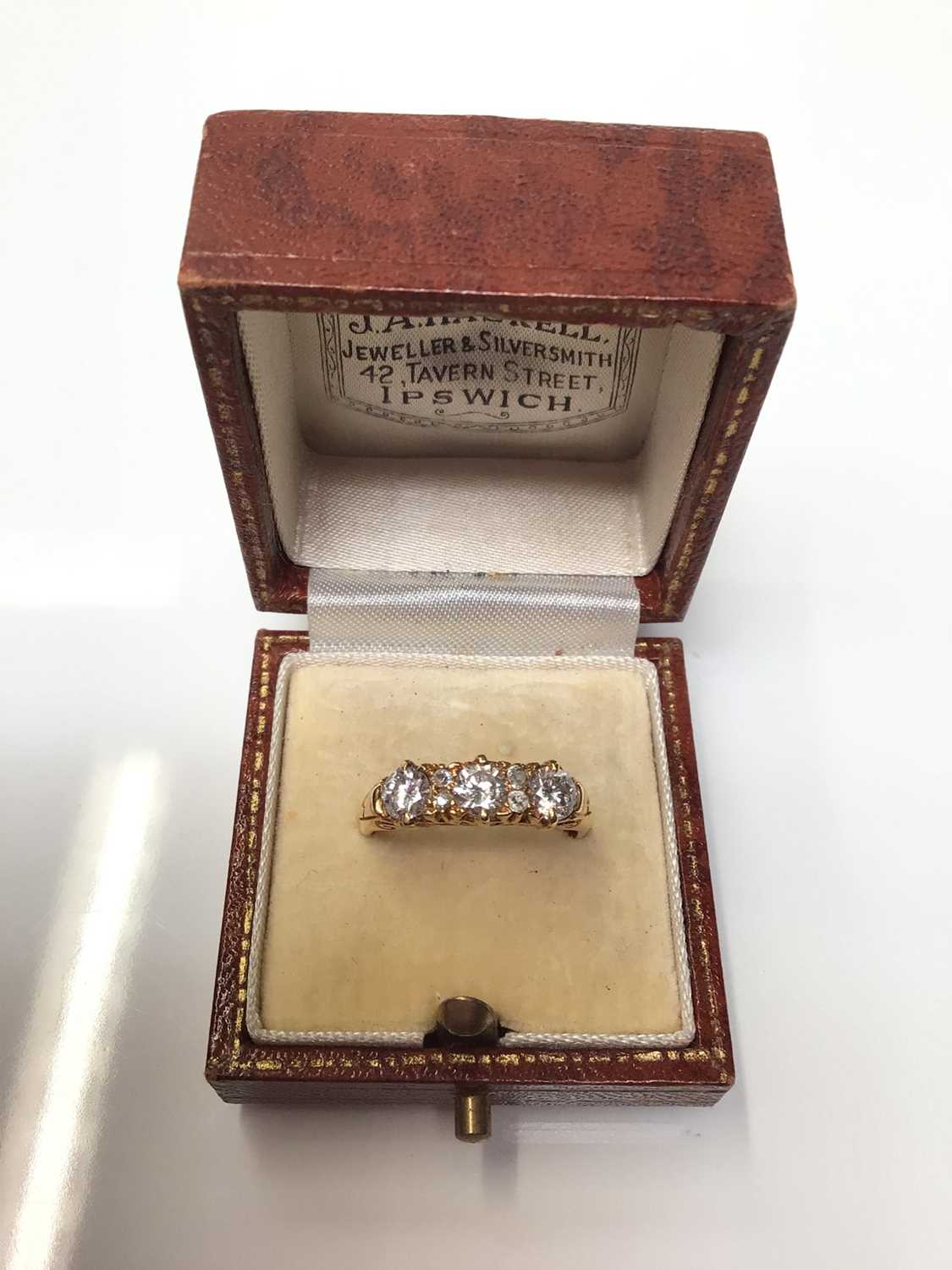 Lot 115 - Diamond ring with three brilliant cut diamonds interspaced by four small old cut diamonds