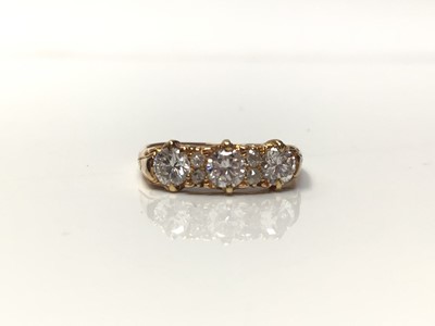 Lot 115 - Diamond ring with three brilliant cut diamonds interspaced by four small old cut diamonds