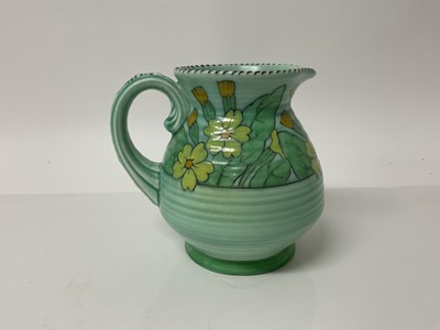 Lot 1118 - Charlotte Rhead Crown Ducal jug with floral decoration on green ground, signed, 15.5cm high