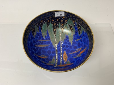 Lot 1121 - Carlton ware lustre bowl decorated with trees on blue ground, 23cm diameter