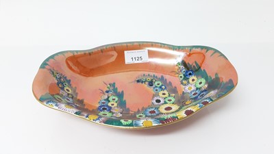 Lot 1125 - Carlton ware lustre shaped dish with floral decoration on orange ground, 25.5cm wide