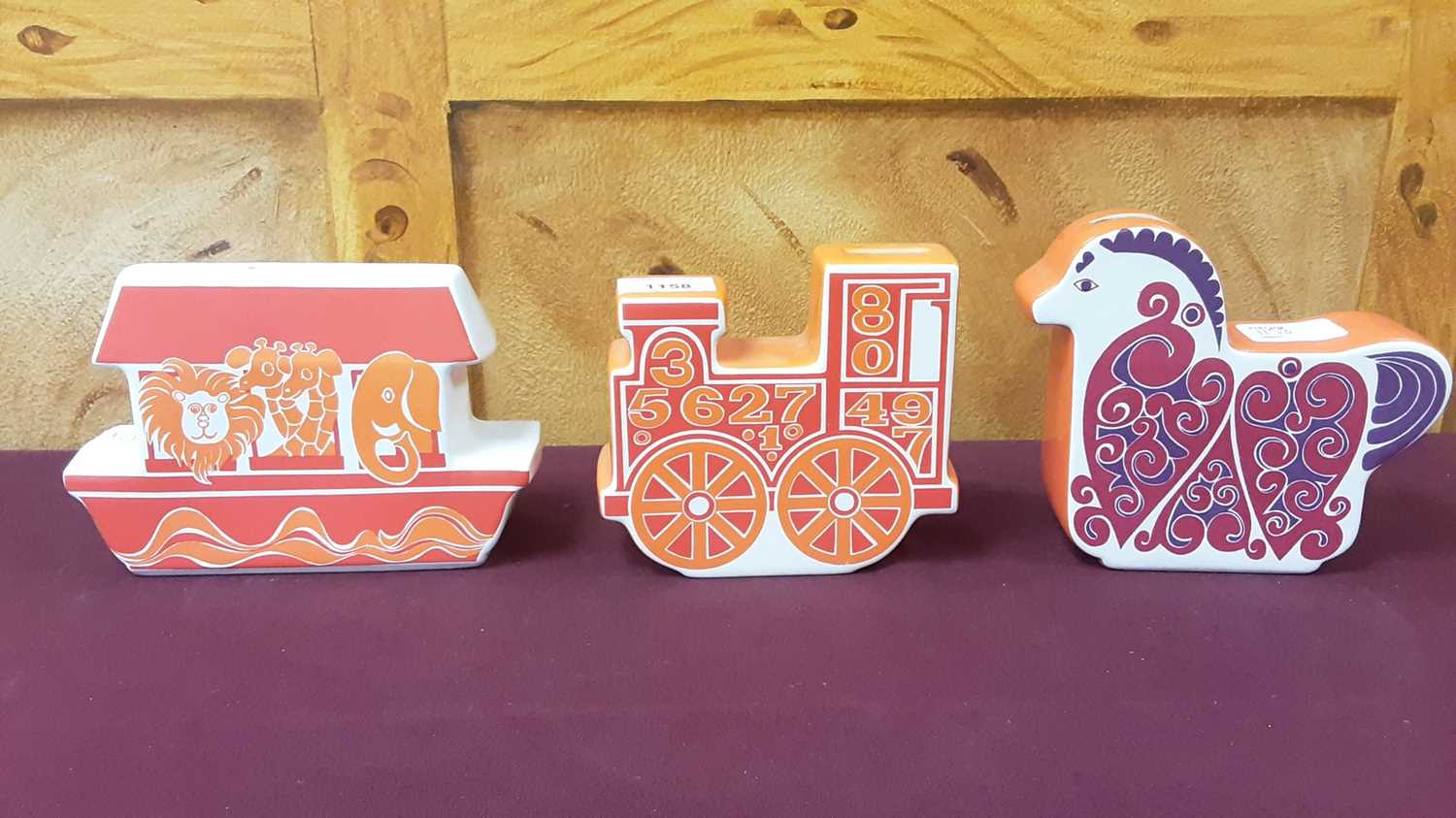 Lot 1158 - Three Carlton ware novelty money boxes including train and Noahs Ark