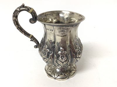 Lot 232 - Victorian silver mug with embossed floral decoration