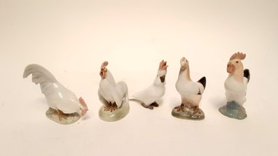 Lot 1186 - Four Royal Copenhagen porcelain chickens, numbered 1126, 1127, 2192 and 2193, together with a Copenhagen Cockatoo, numbered 2178 (5)