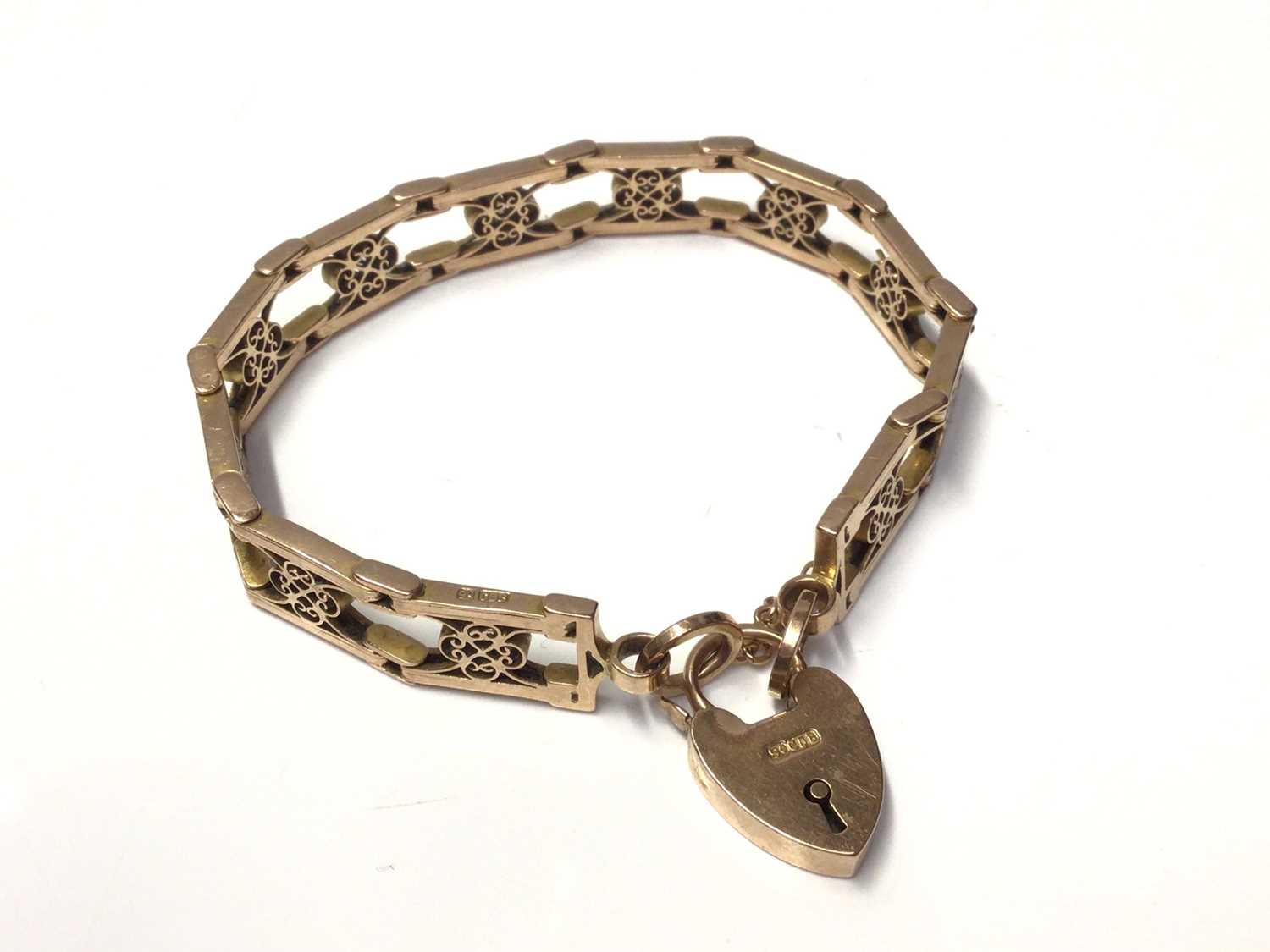 Lot 138 - 9ct gold fancy link panel bracelet with padlock clasp