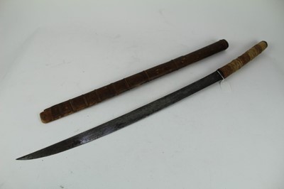 Lot 863 - Eastern sword with rope bound bamboo grip, steel blade stamped X20 in wooden scabbard, blade 63cm in length