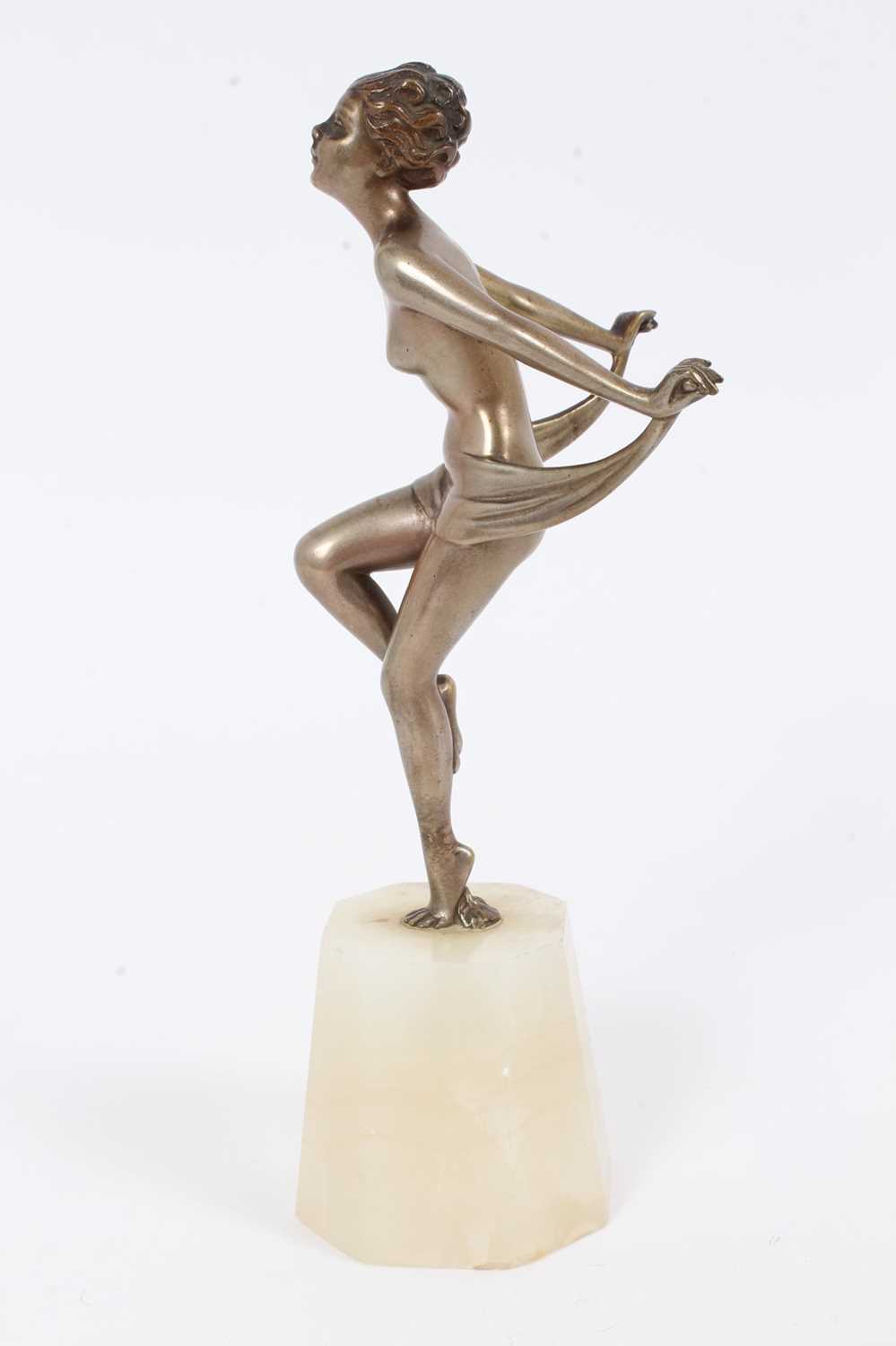 Lot 2530 - Art Deco silvered bronze figure of a nude woman dancing, on an onyx base, 18cm high