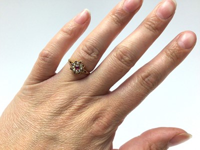 Lot 155 - Edwardian 18ct gold ruby and seed pearl flower head cluster ring