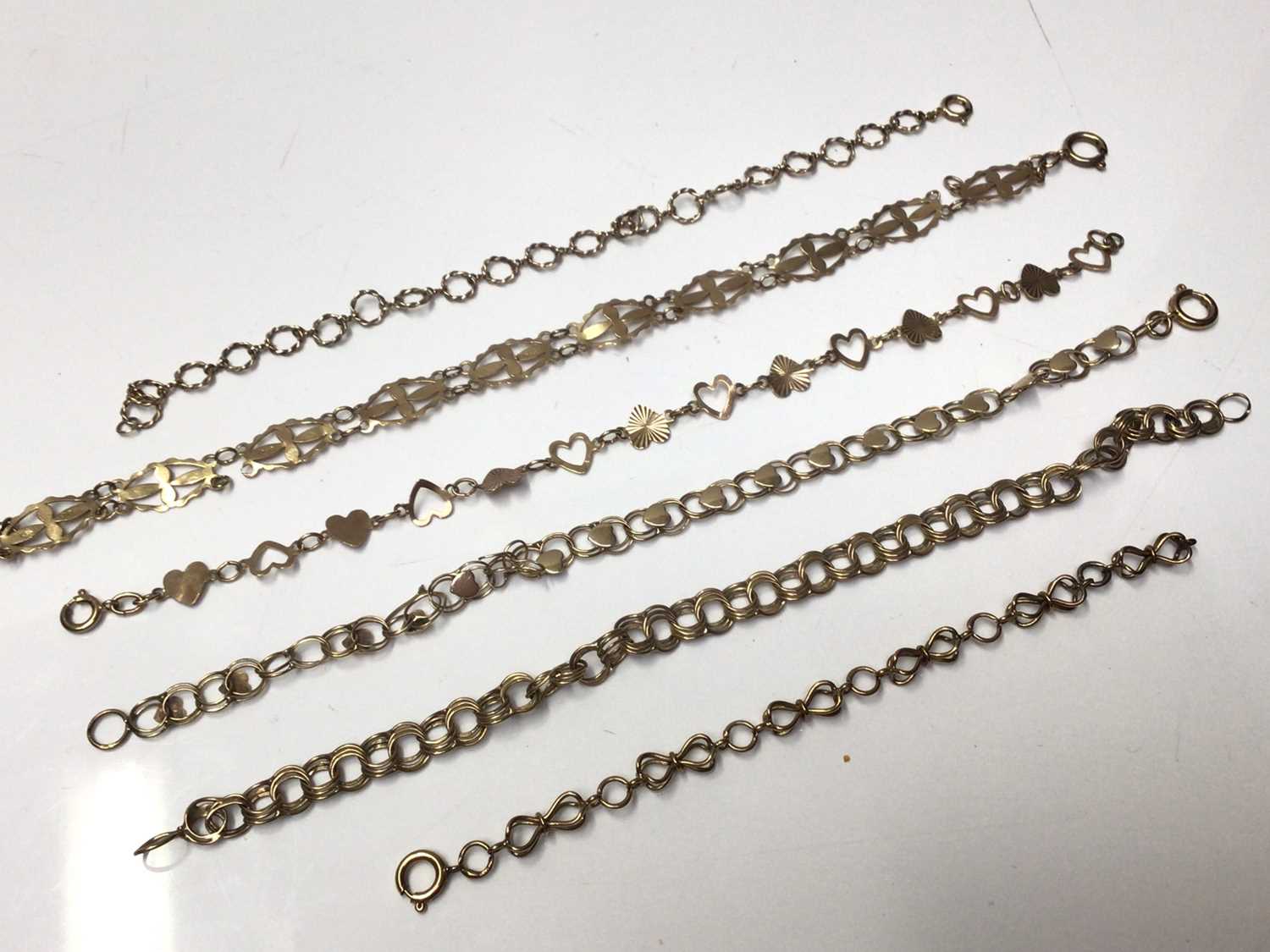 Lot 175 - Six 9ct gold fancy link bracelets