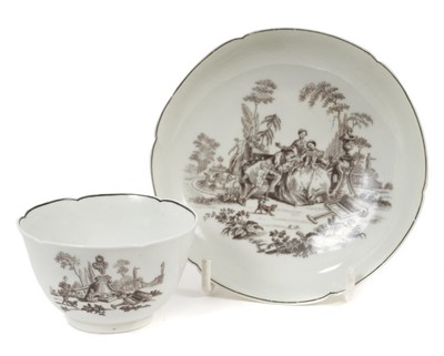 Lot 237 - 18th century Worcester petal shaped tea bowl and saucer, printed by Robert Hancock with L’Amour, circa 1760