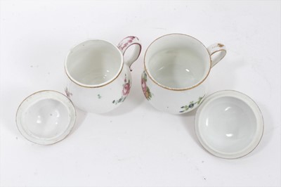 Lot 242 - Paris porcelain flower painted custard cup and cover, circa 1800, and a spirally fluted custard cup and cover