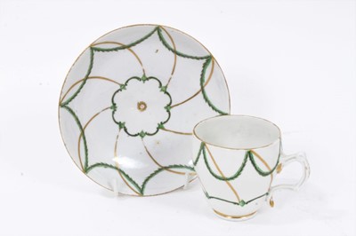 Lot 244 - 18th century Bristol ogee shaped coffee cup and saucer, decorated in green and gilt, circa 1775