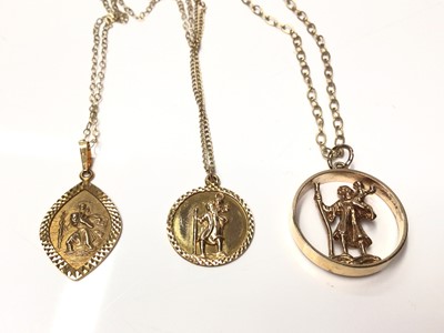 Lot 179 - Three 9ct gold St. Christopher pendants on 9ct gold chains