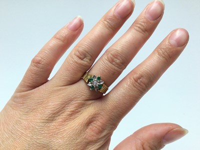 Lot 187 - 18ct gold emerald and diamond cluster ring