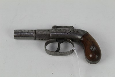 Lot 901 - Mid-19th century American percussion bar hammer derringer pistol with patent dates for April 1845, turn- off two stage barrel, engraved frame with walnut bag grips, 12 cm overall