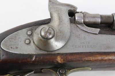 Lot 911 - Victorian Snider rifle, the lock with crowned VR cipher and '1871 Enfield', ordnance stamps to barrel, walnut stocked with brass mounts and steel ramrod.