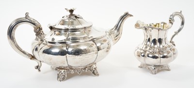 Lot 338 - Early Victorian silver tea pot of melon forn with engraved dedication  and  matching cream jug