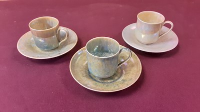 Lot 1235 - Three Ruskin pottery coffee cans and saucers