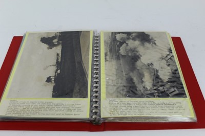 Lot 805 - Two albums containing Second World War official press photographs of ariel bombing, together with typed annotations (54 photographs)