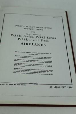 Lot 811 - Interesting group of reproduced and bound Second World War parts catalogues and manuals and operational flight instructions for P-38H, P-38J, P-38L and F-5B, (5 items)