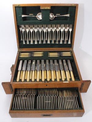 Lot 405 - An extensive early 20th century canteen of silver cutlery, 111 pieces in total, in fitted oak case