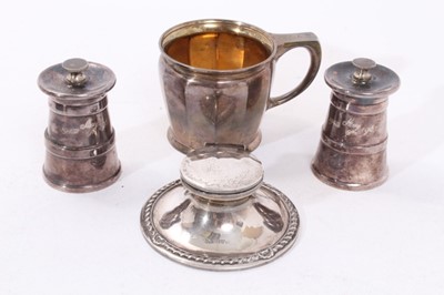 Lot 424 - George V silver inkwell, together with a christening cup and a pair of 1960s silver pepper grinders