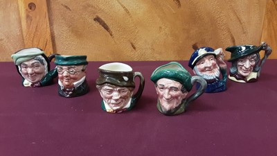 Lot 1256 - Collection of nineteen small Royal Doulton character jugs to include The Sleuth, The Guardsman and Catherine Howard, together with five other character jugs (24)