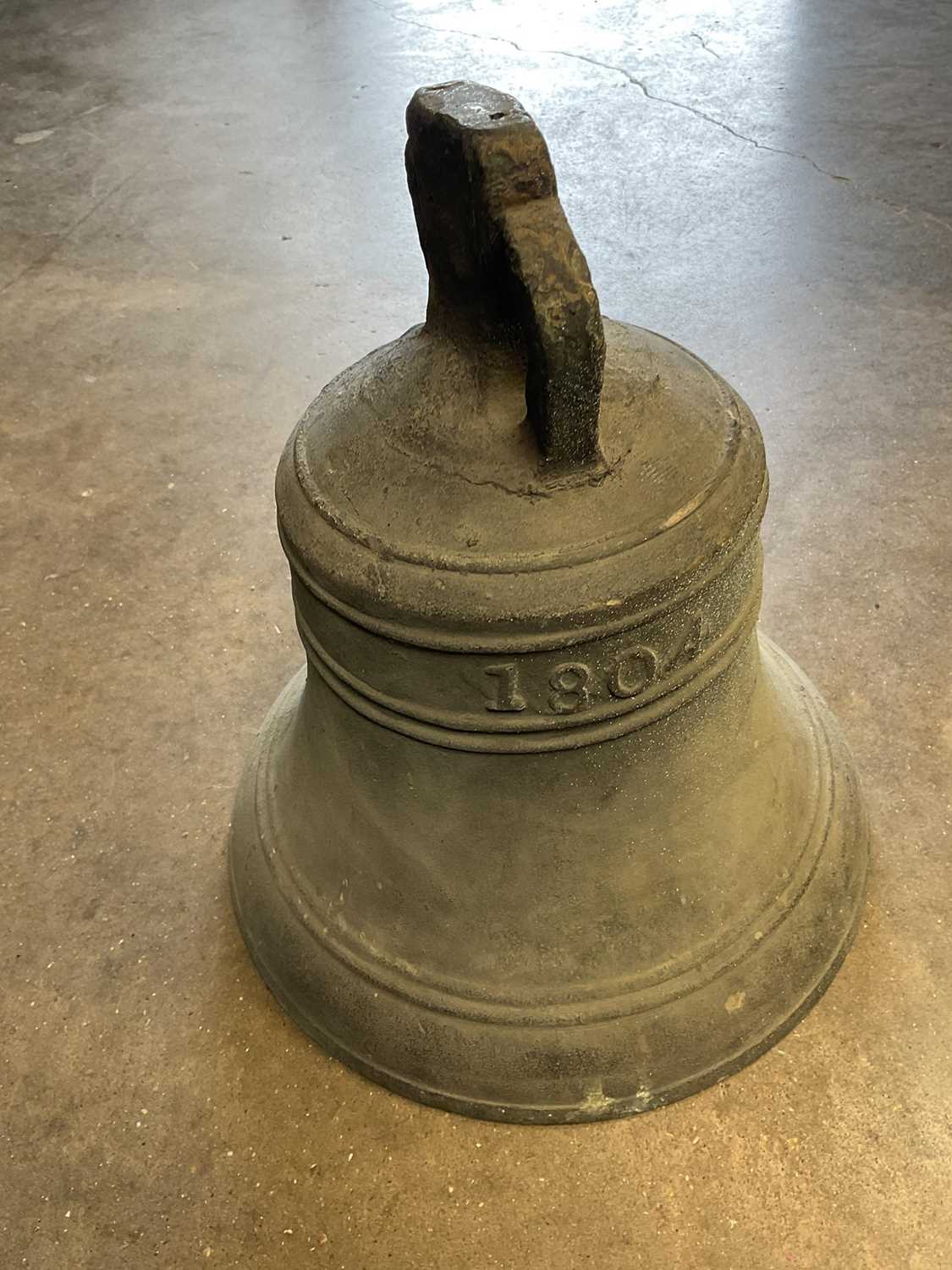 Lot 2616 - 19th century cast bronze or bell metal church bell, dated 1804, 32cm high