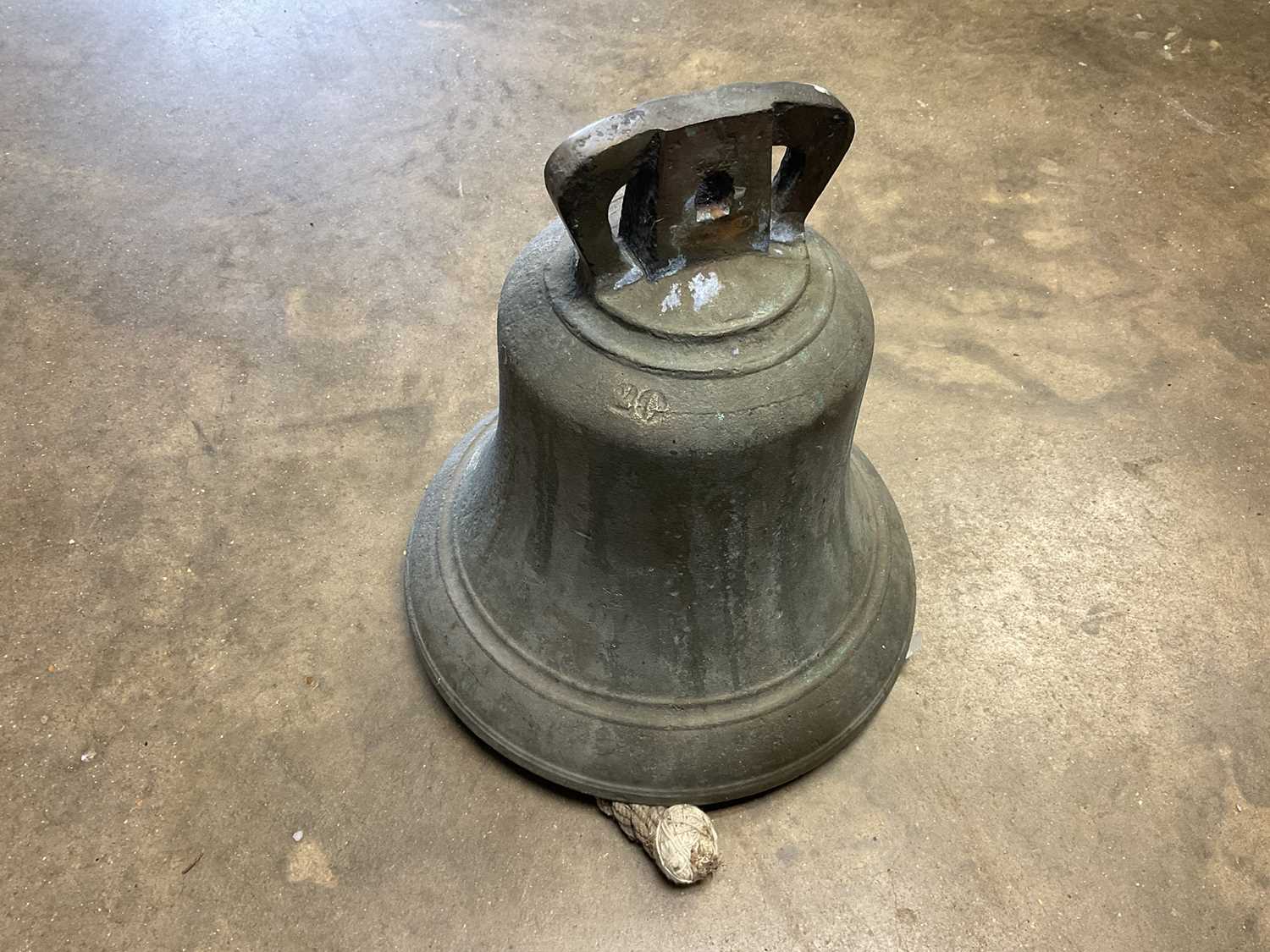 Lot 2621 Antique bell, stamped 2G, 30cm high