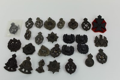 Lot 833 - Collection twenty seven Second World War Wartime Economy issue cap badges, various regiments including R.E.M.E., Essex Regiment and Army Ordance Corps (27 badges)