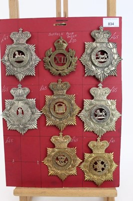 Lot 834 - Collection of eight Victorian and later blue cloth helmet plates, to include East Lancashire 2nd Vol. Battn. and Suffolk regiment, mounted on card (8 badges)