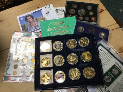 Lot 513 - World - Mixed coinage to include G.B. Royal Mint proof sets 1975, 1982, 1998, Westminster gold plated coins x 12, U.S. 'States' Quarter Dollar collection and others (Qty)
